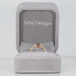 14K yellow gold red spinel ring with diamond accents