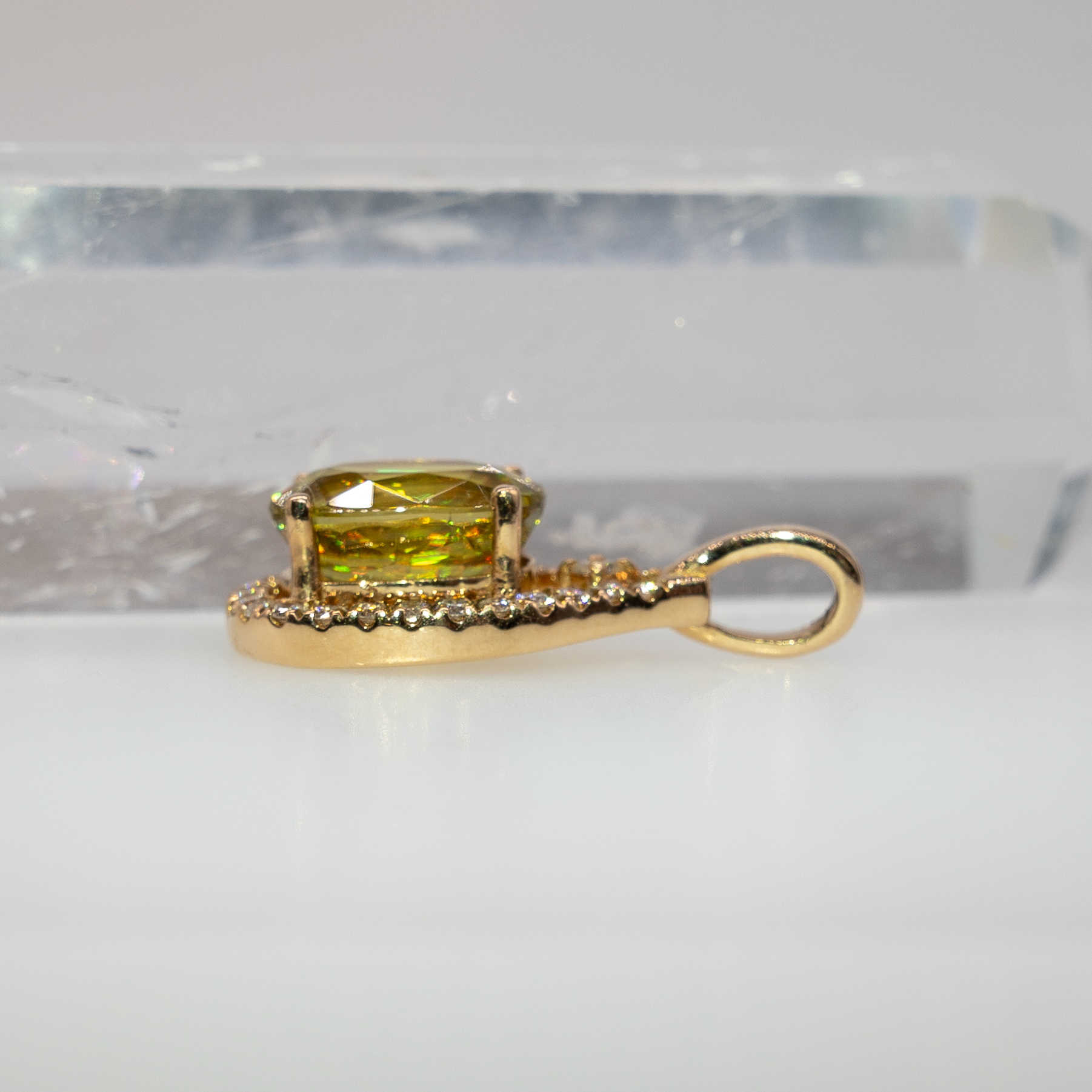Sphene oval pendant with diamond accents in 14k yellow gold