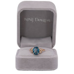 14K rose gold London blue topaz ring with diamond accents