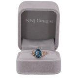 14K rose gold London blue topaz ring with diamond accents