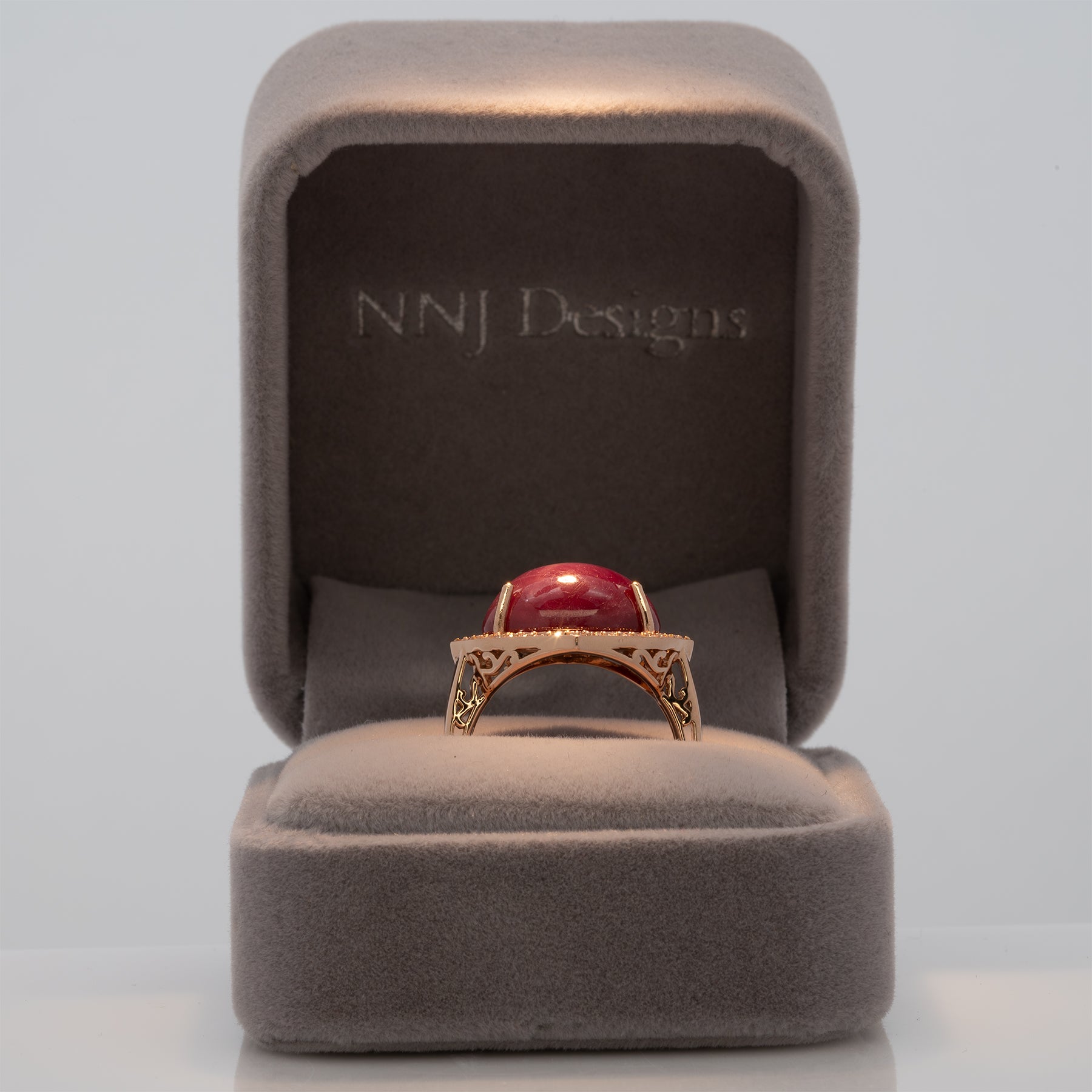 14K rose gold star ruby cabochon ring with diamond halo