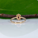 14K yellow gold padparadscha sapphire ring with diamond accents