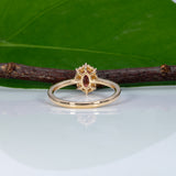 14K yellow gold padparadscha sapphire ring with diamond accents