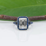 platinum lab grown diamond ring with blue sapphire accents