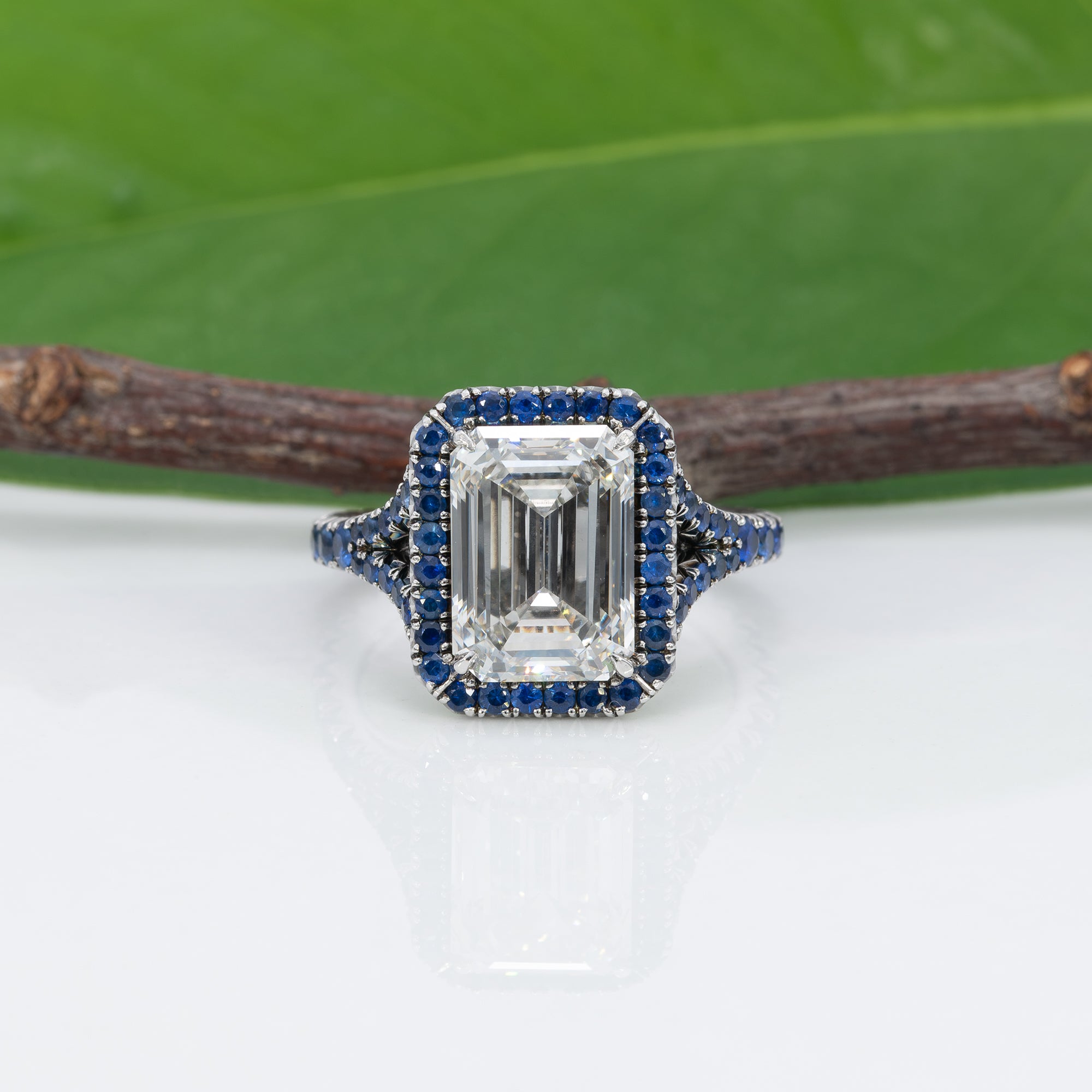platinum lab grown diamond ring with blue sapphire accents