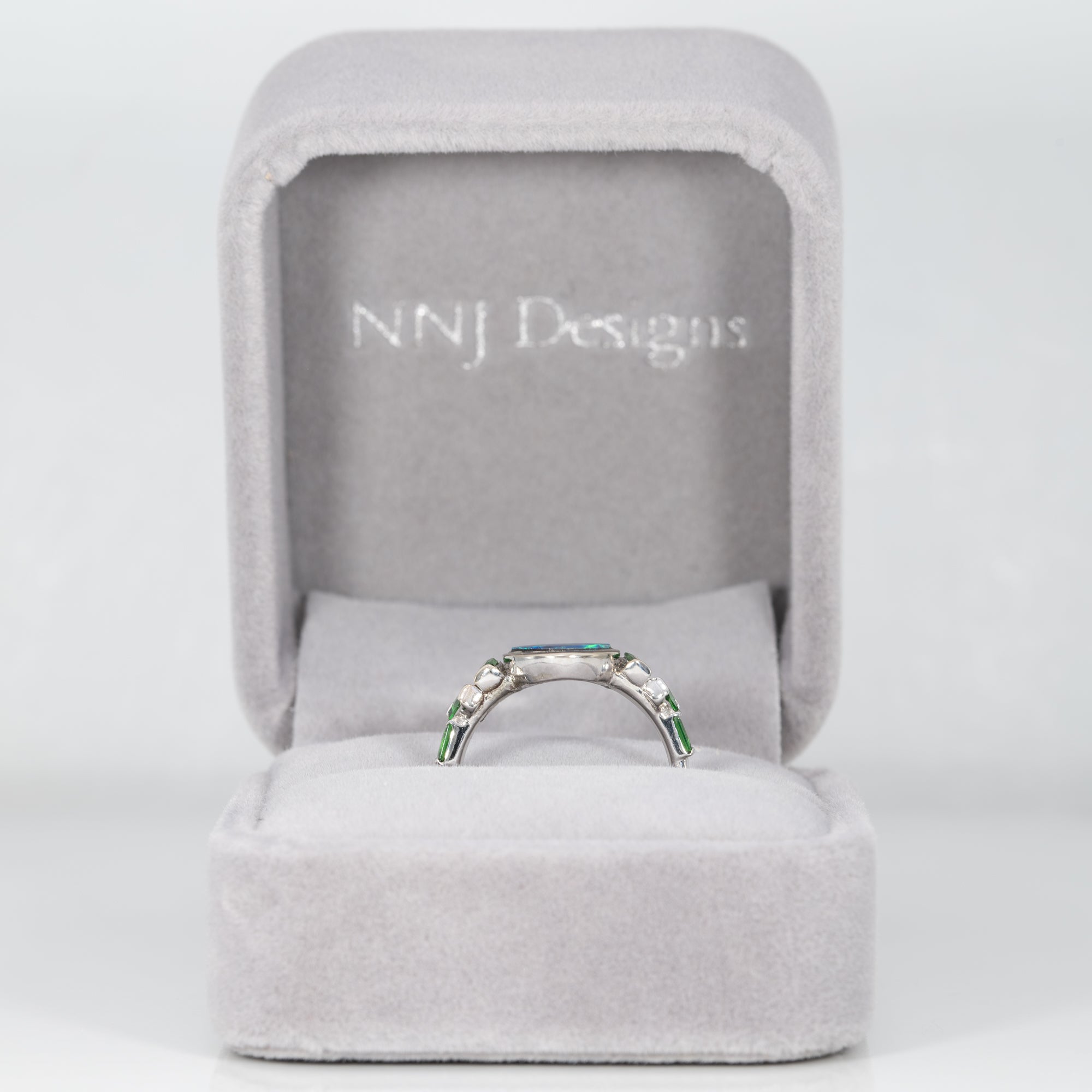 14K white gold boulder opal cabochon ring with tsavorite accents