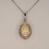 14K white & yellow gold ethiopian opal pendant with diamond accents