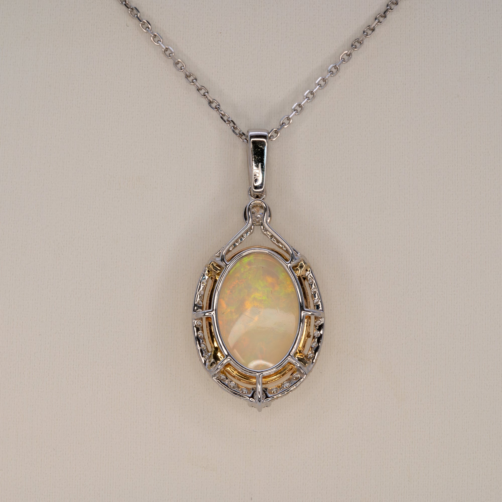 14K white & yellow gold ethiopian opal pendant with diamond accents