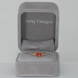 14K yellow gold padparadscha sapphire oval ring with diamond accents