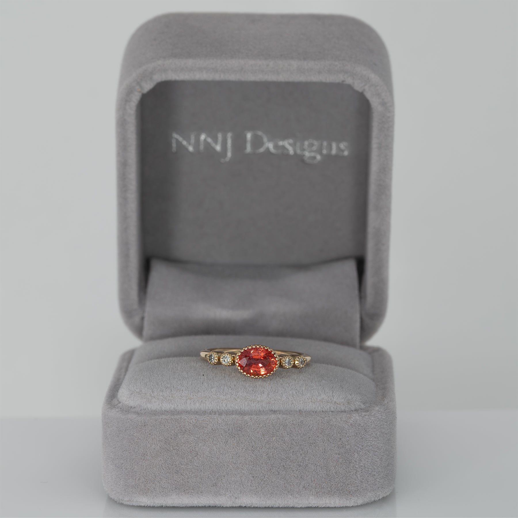14K yellow gold padparadscha sapphire oval ring with diamond accents