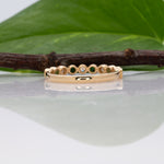 14K yellow gold Zambian emerald band ring with diamond accents