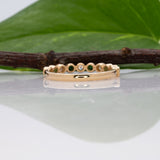 14K yellow gold Zambian emerald band ring with diamond accents