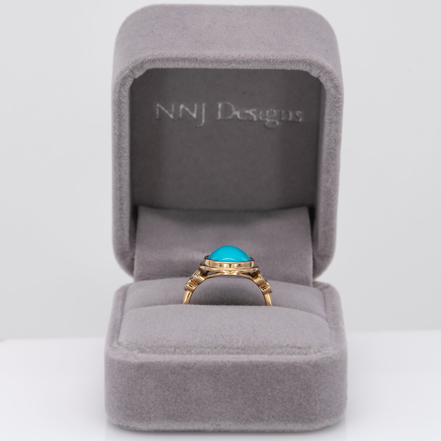 14K yellow gold turquoise cabochon ring with diamond accents