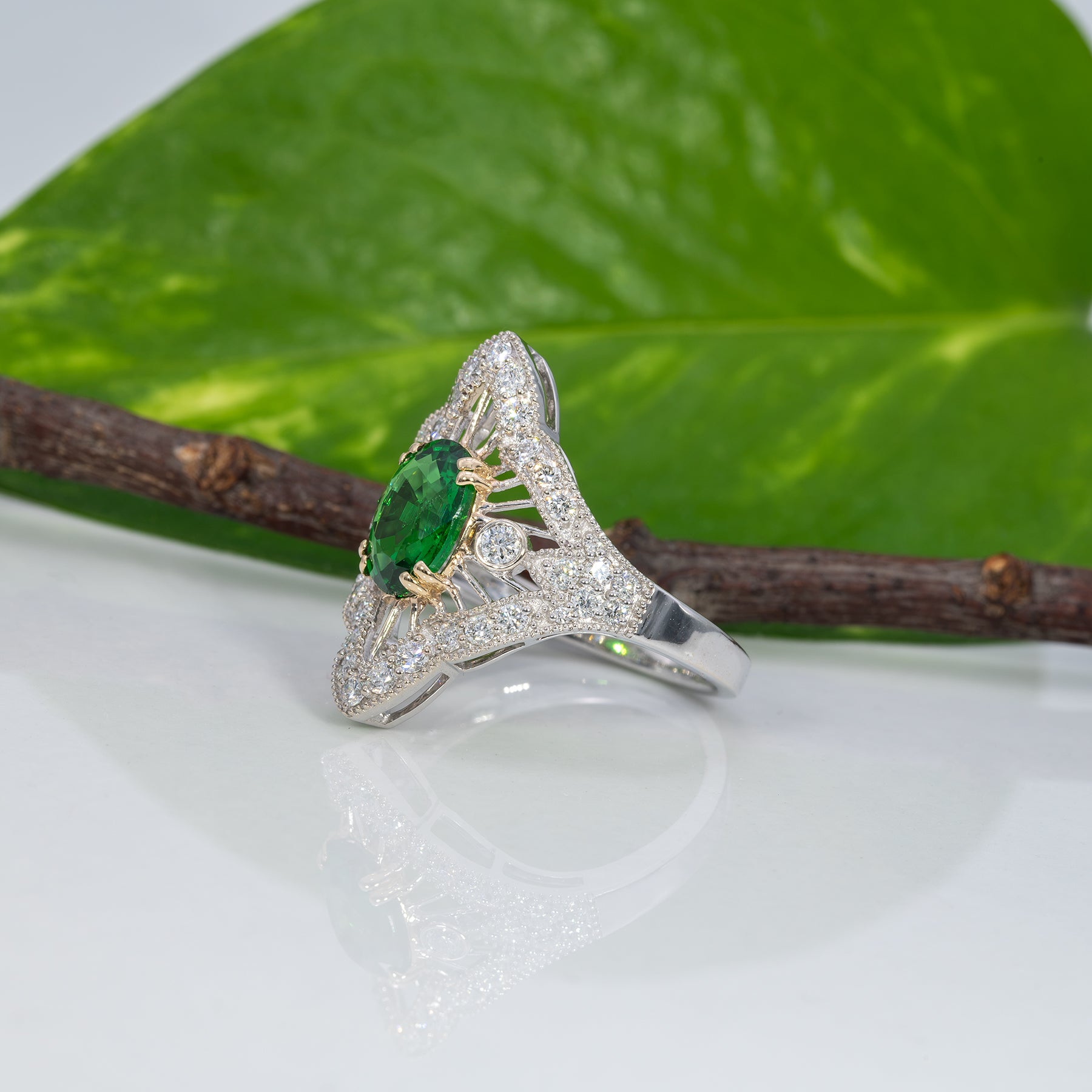 14K two-tone gold tsavorite garnet ring with diamond accents