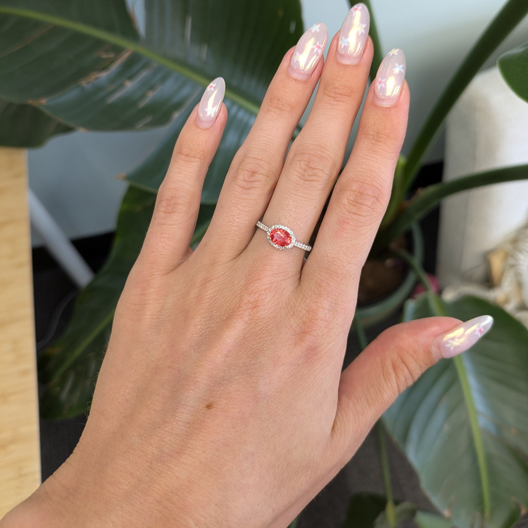 14K white gold padparadscha sapphire oval ring with diamond halo