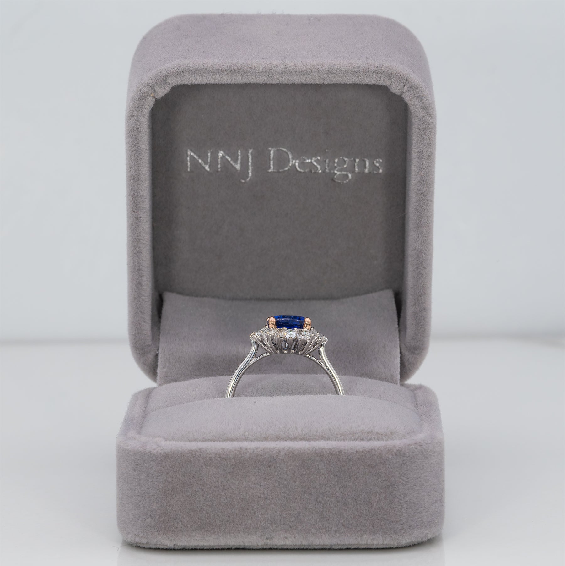 14K white and rose gold tanzanite ring with diamond accents