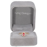 14K yellow gold padparadscha sapphire ring with diamond accents