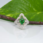 14K two-tone gold tsavorite garnet ring with diamond accents