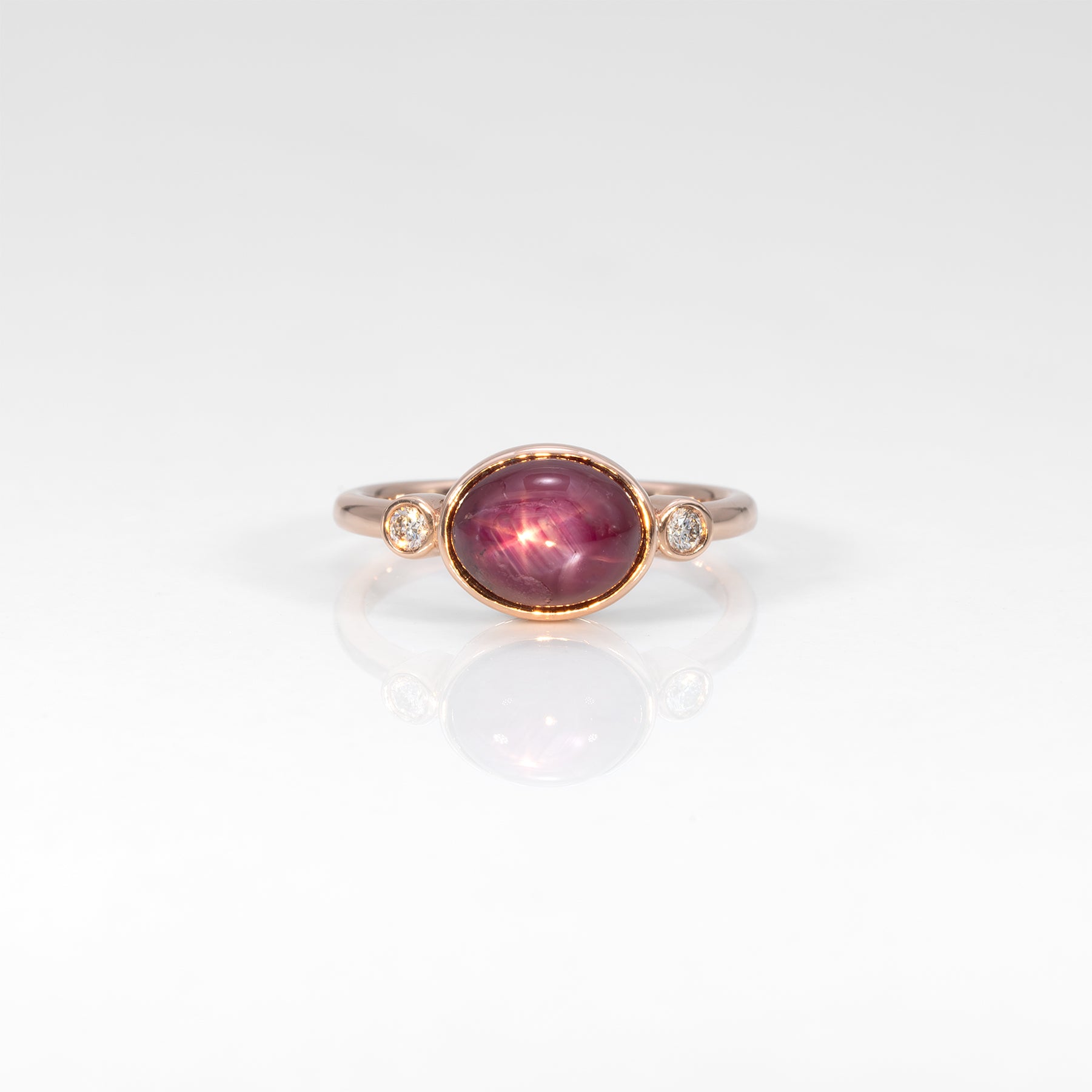 14K rose gold star ruby cabochon ring with diamond accents