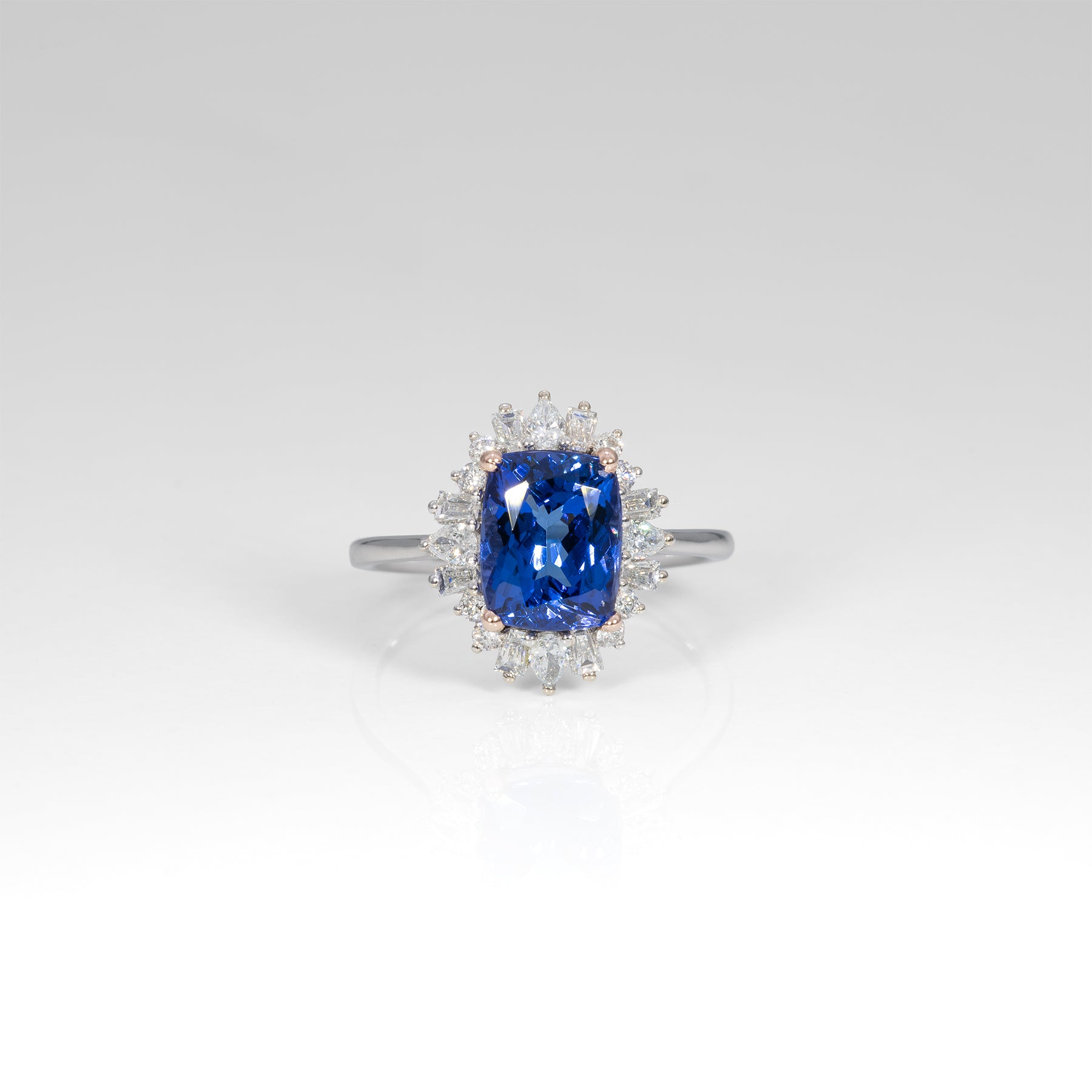 14K white and rose gold tanzanite ring with diamond accents