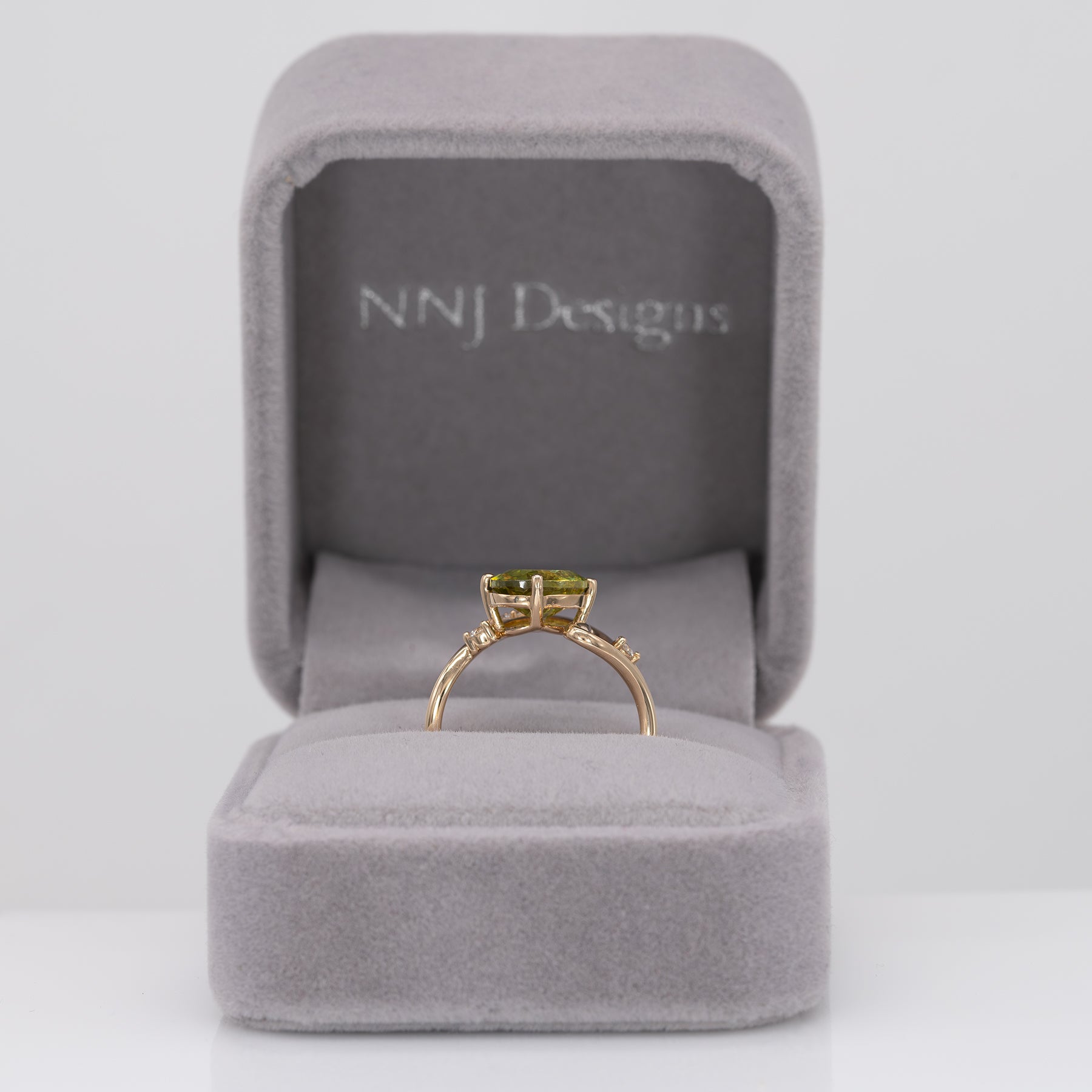 14K yellow gold sphene ring with diamond halo