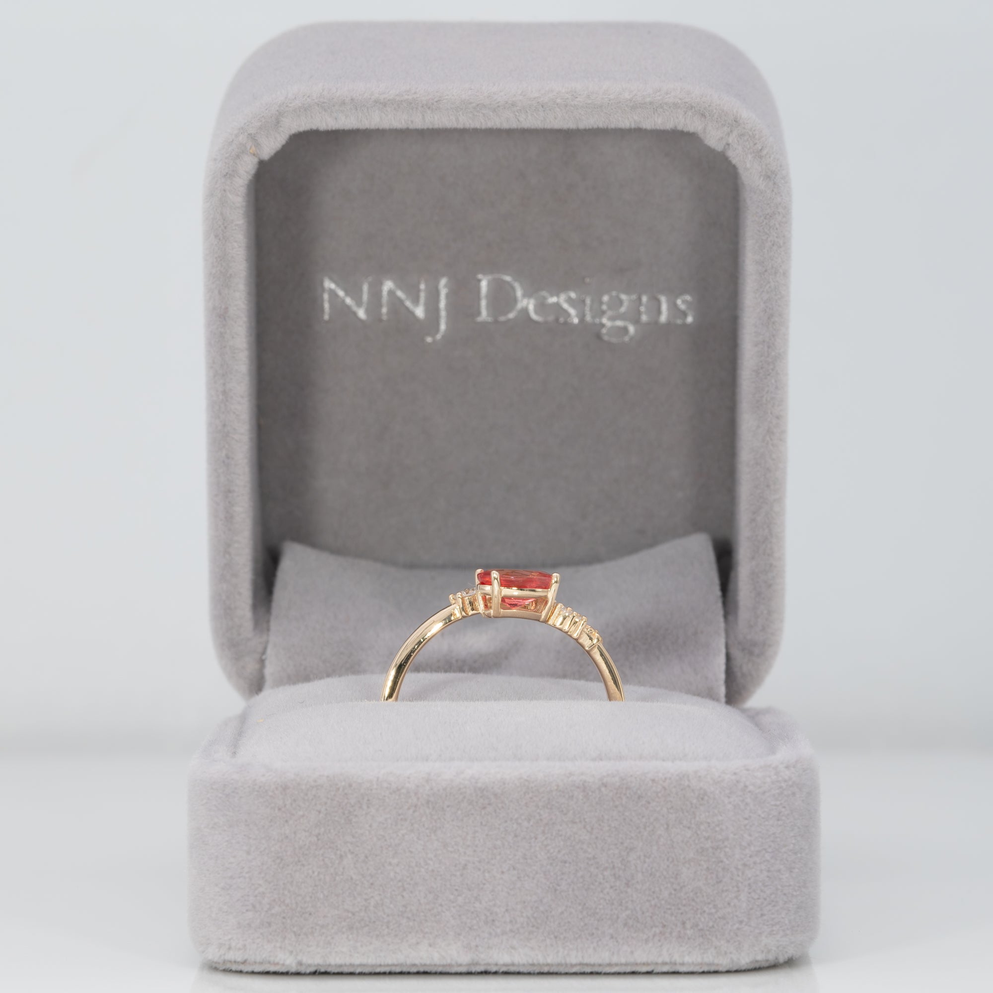 14K yellow gold padparadscha sapphire ring with diamond accents