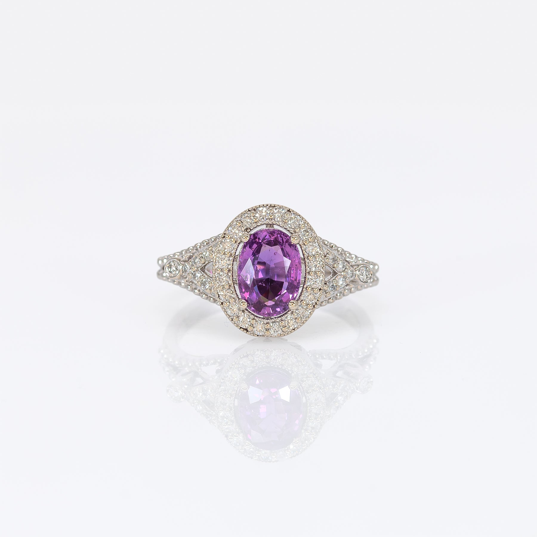 14K white gold pink sapphire oval ring with diamond halo
