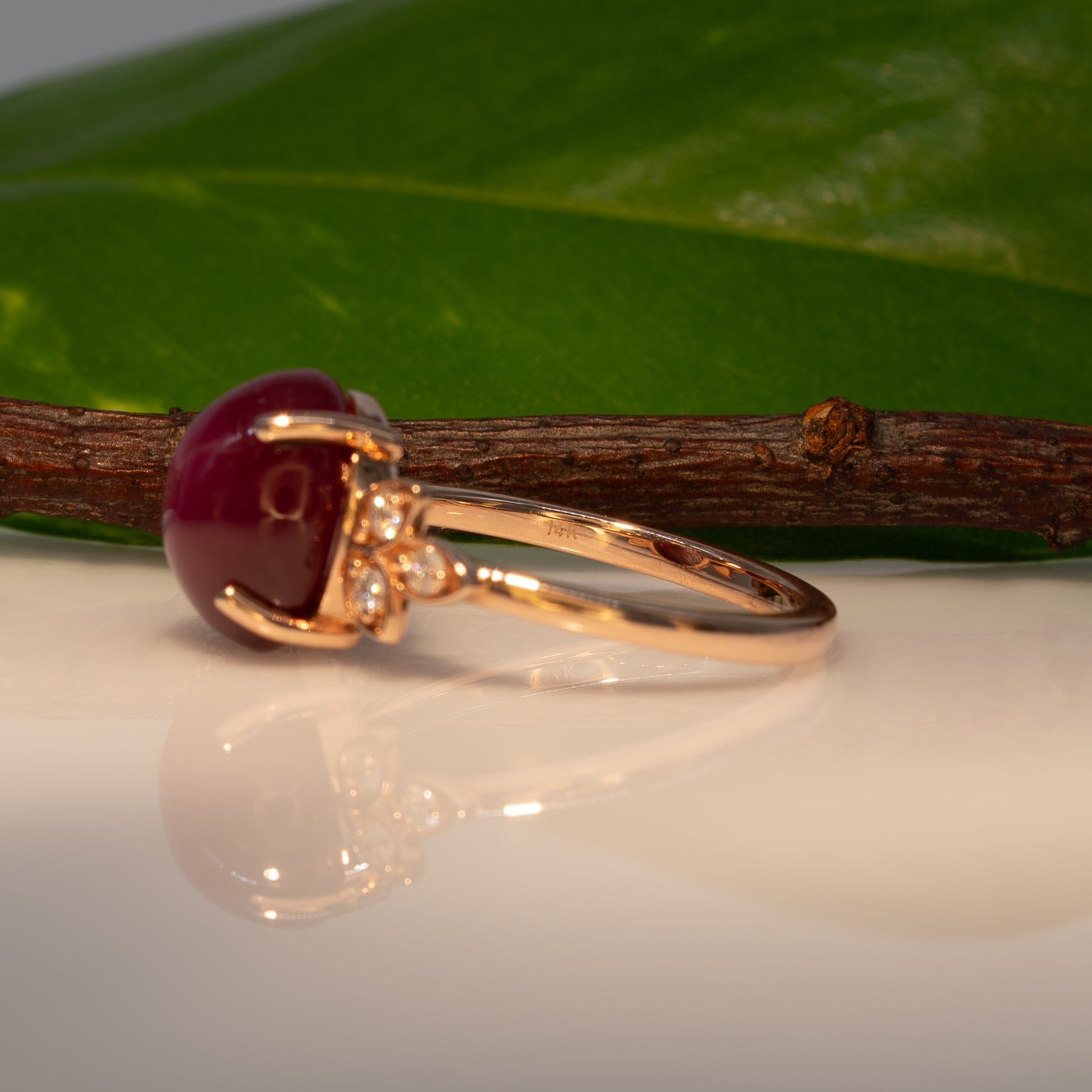 14K rose gold star ruby cabochon ring with diamond accents
