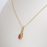 14K yellow gold padparadscha sapphire pendant