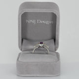 14K white gold pink sapphire oval ring with diamond halo