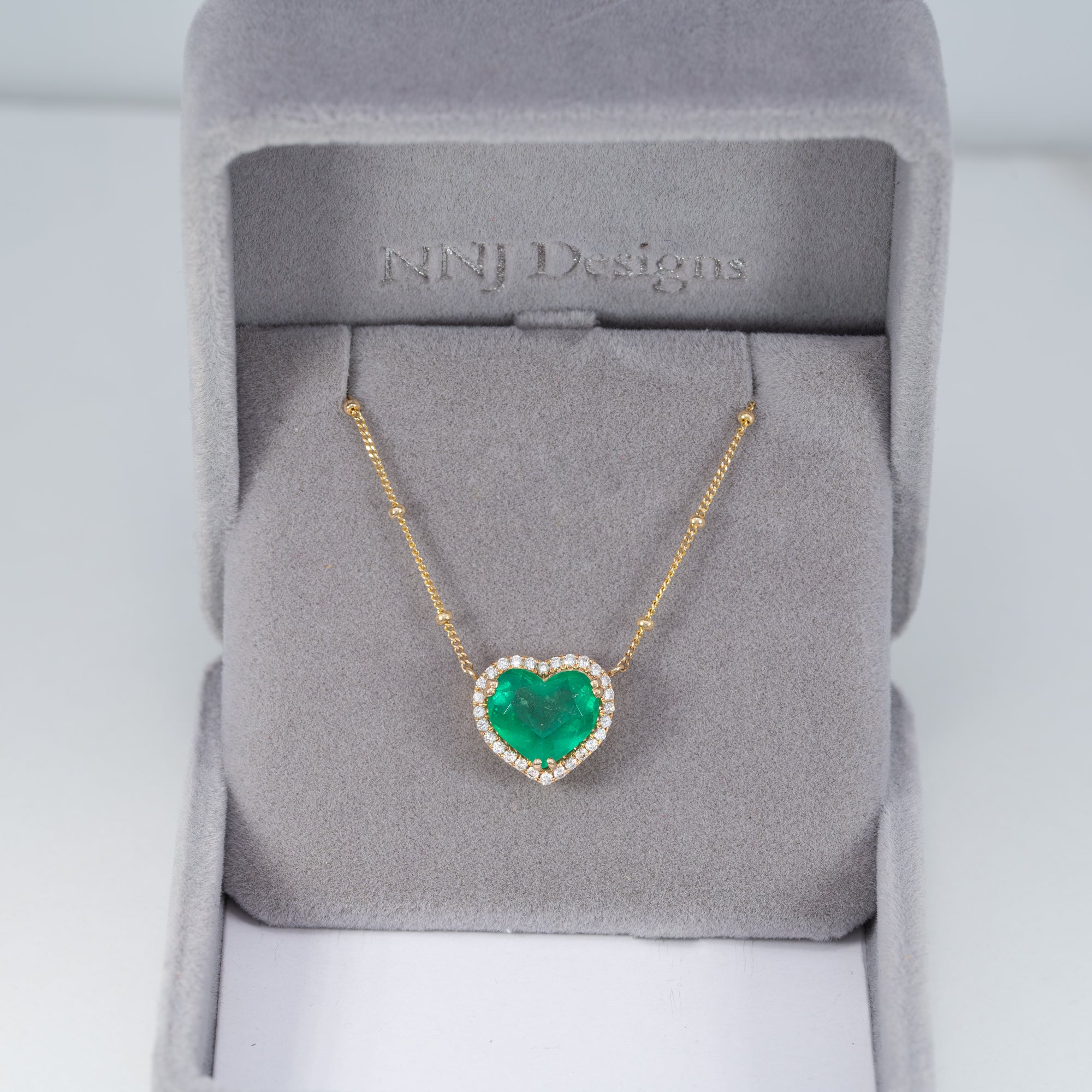 14K yellow gold colombian emerald pendant with diamond accents