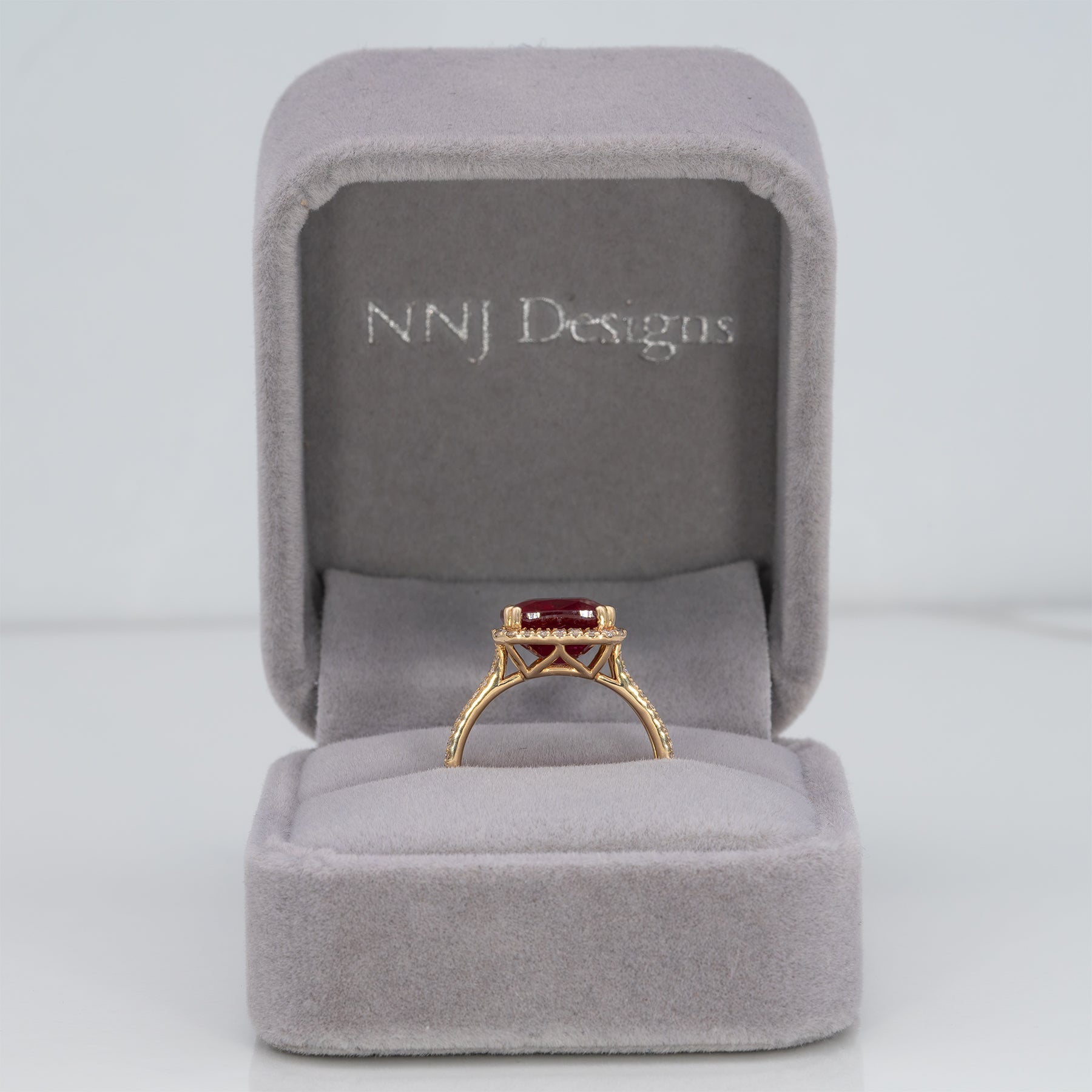 14K yellow gold Madagascar ruby ring with diamond halo