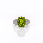 14K white gold peridot oval ring with diamond halo