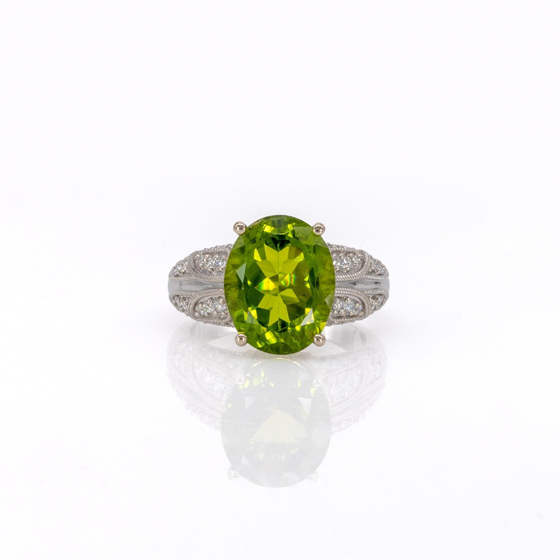 14K white gold peridot oval ring with diamond halo