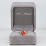 14K yellow gold padparadscha sapphire ring with diamonds
