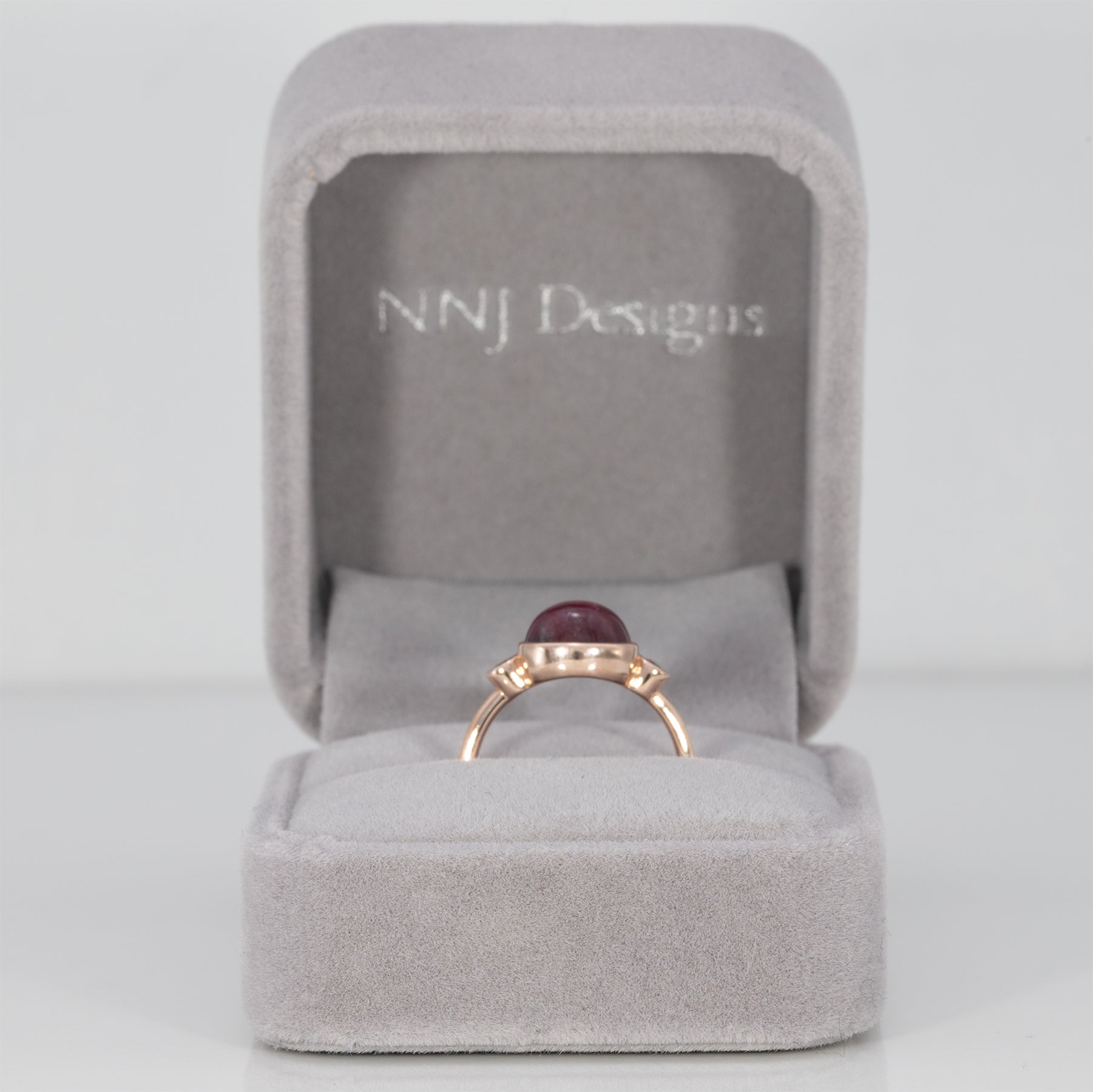 14K rose gold star ruby cabochon ring with diamond accents