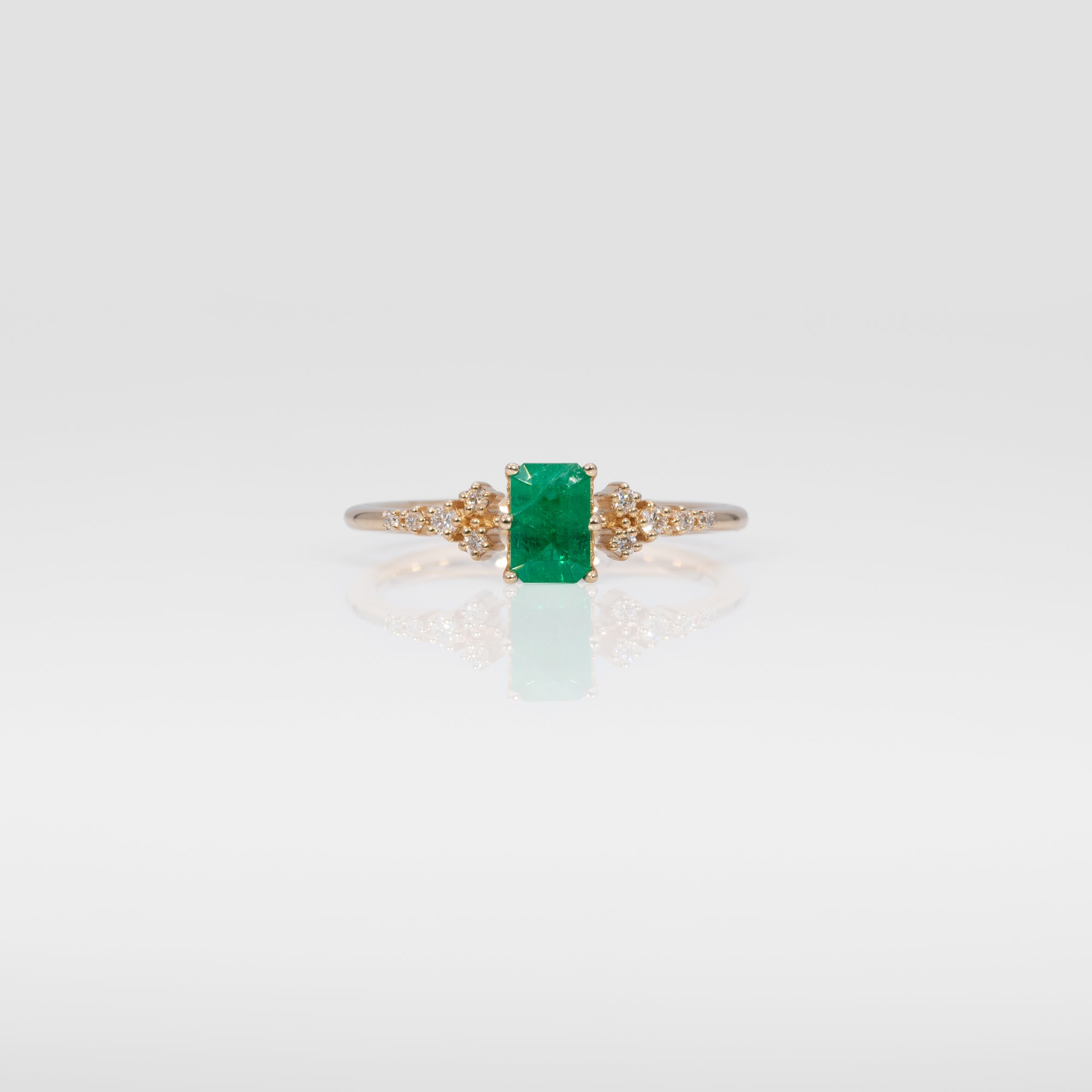 14K yellow gold colombian emerald ring with diamond accents