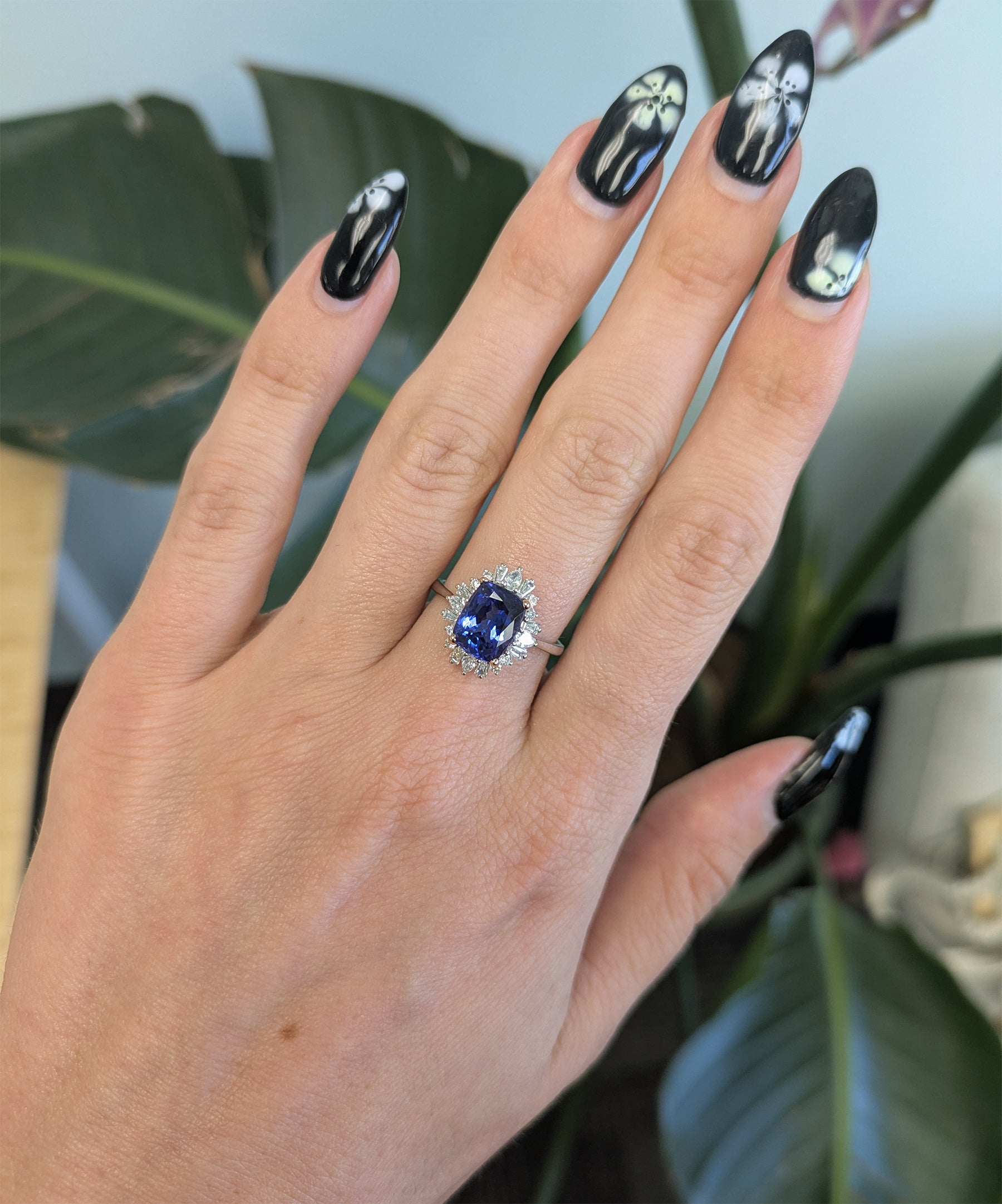 14K white and rose gold tanzanite ring with diamond accents
