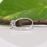14K white gold alexandrite ring with diamond accents
