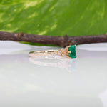 14K yellow gold colombian emerald ring with diamond accents