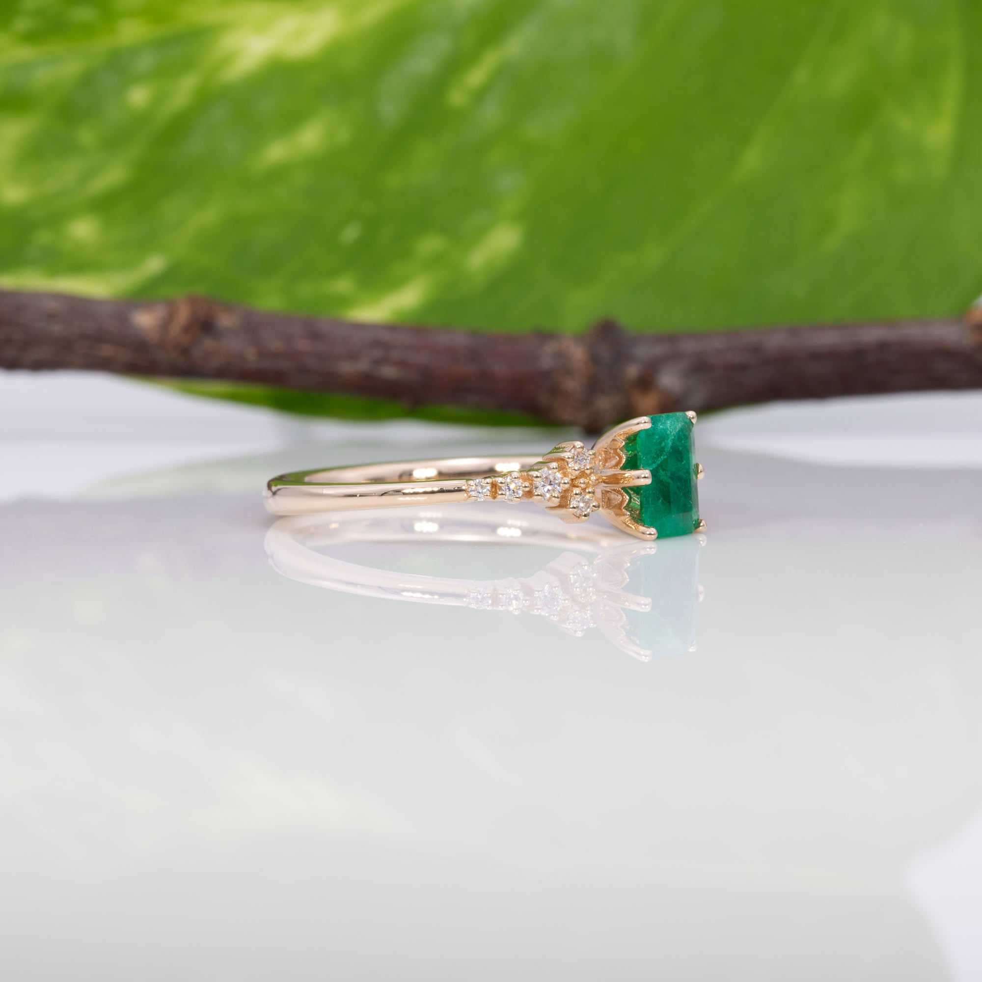 14K yellow gold colombian emerald ring with diamond accents