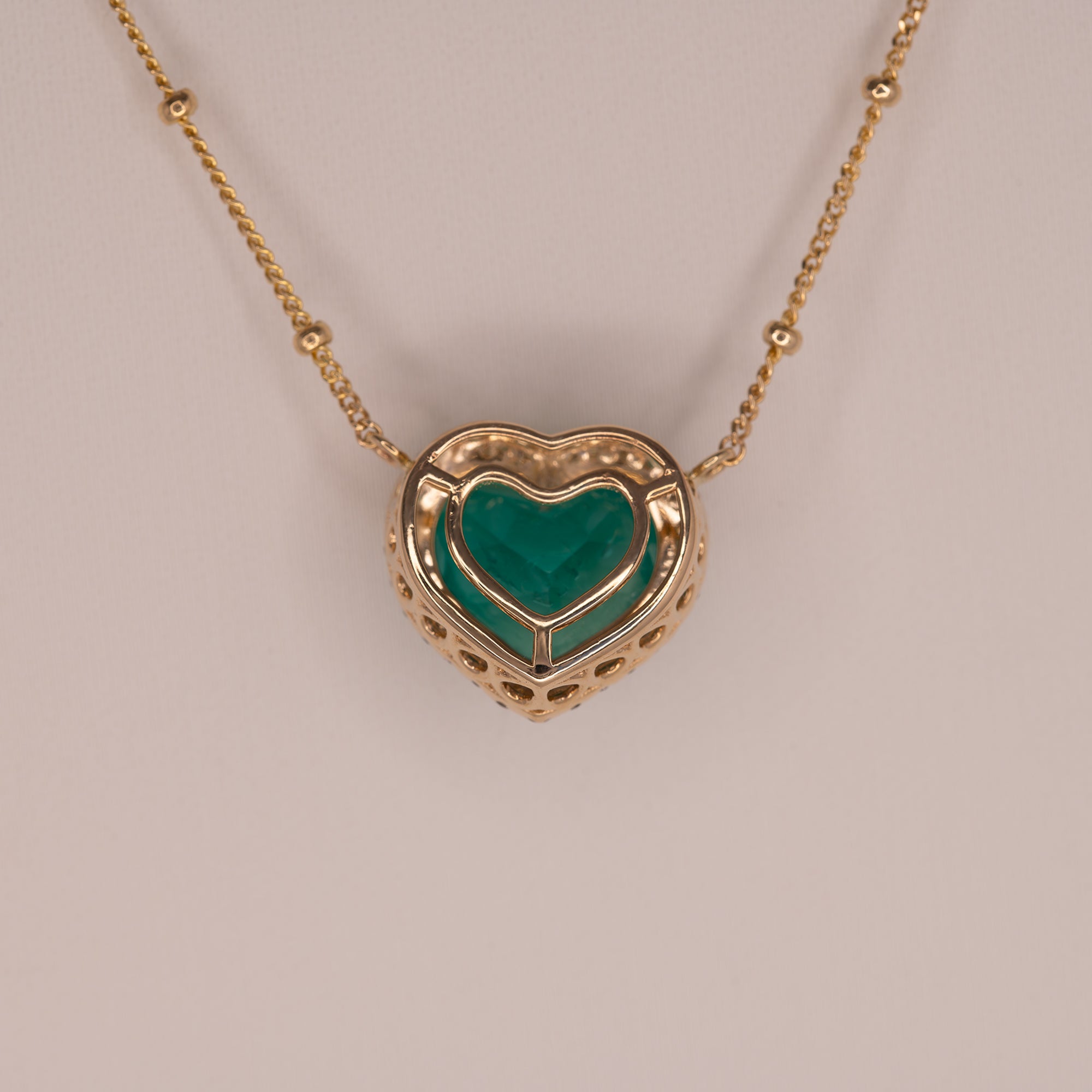 14K yellow gold colombian emerald pendant with diamond accents
