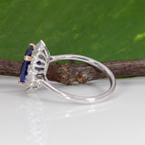14K white and rose gold tanzanite ring with diamond accents