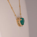 14K yellow gold colombian emerald pendant with diamond accents