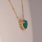 14K yellow gold colombian emerald pendant with diamond accents