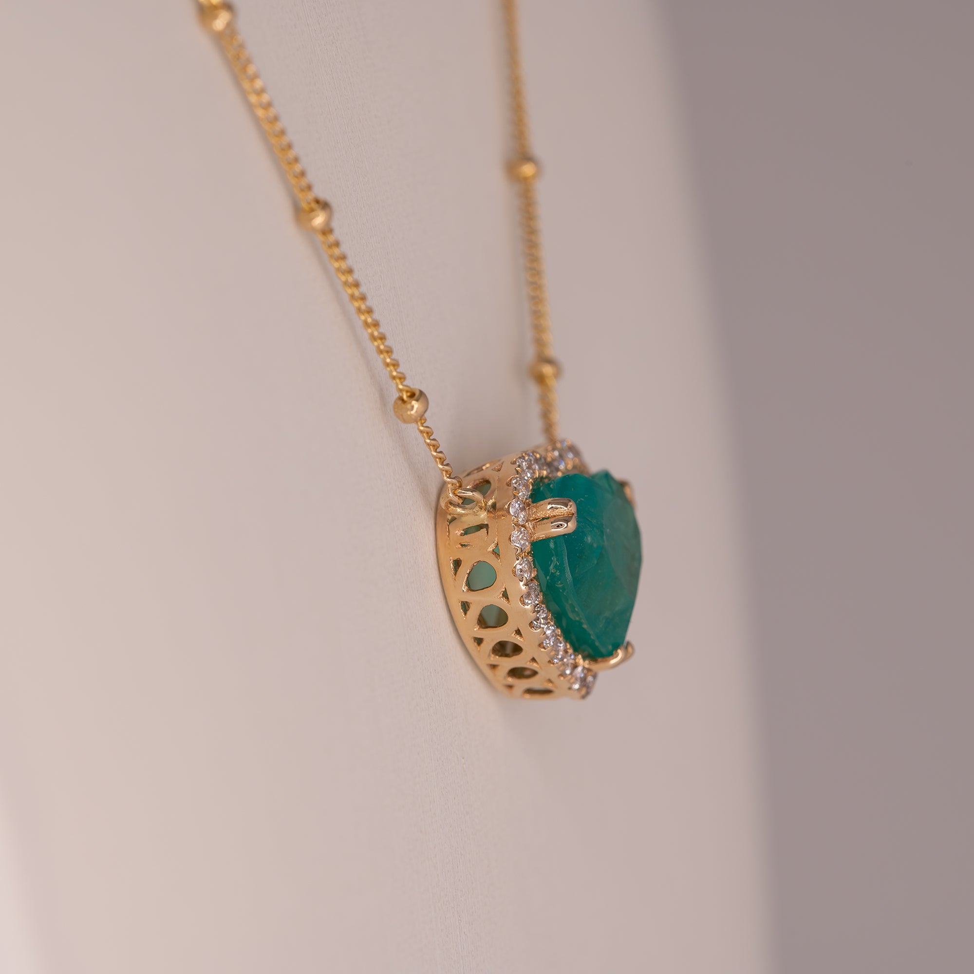 14K yellow gold colombian emerald pendant with diamond accents