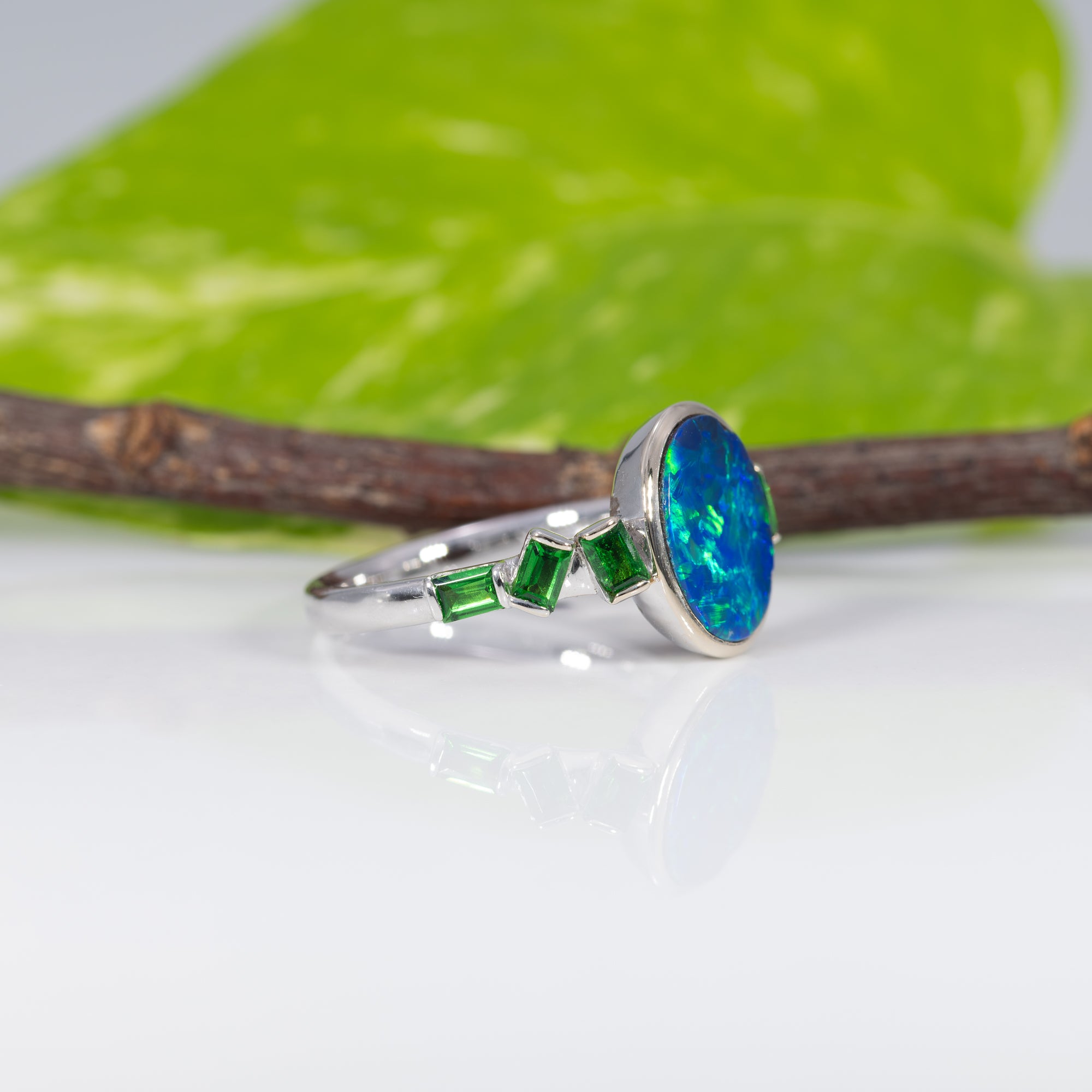 14K white gold boulder opal cabochon ring with tsavorite accents