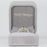 14K yellow gold colombian emerald ring with diamond accents