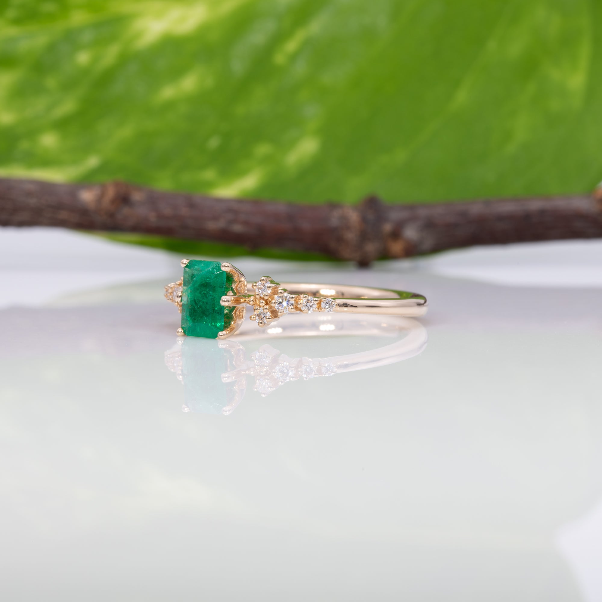14K yellow gold colombian emerald ring with diamond accents
