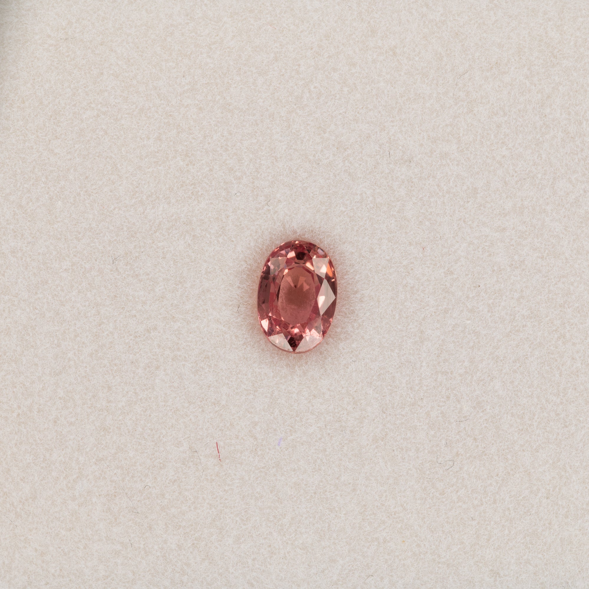 0.67 carat natural padparadscha sapphire, oval 5.9x4.1mm pink-orange loose gemstone